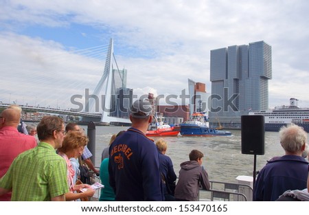 ROTTERDAM - SEPTEMBER 7, 2013: The World Port Days at the port of Rotterdam  on September 7 , 2013 in Rotterdam, People are watching the nautical shows on the water from the riverside