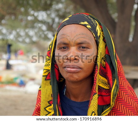 ARUSHA, TANZANIA - JUNE 8 2013 :Unidentified  Barabaig woman with a tribal tattoo ;circulair eye tattoo on June 8 2013 Arusha. Tanzania has more than 120 different tribes within its borders.