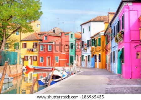 colorful houses by the water canal at the island Burano near venice, Italy