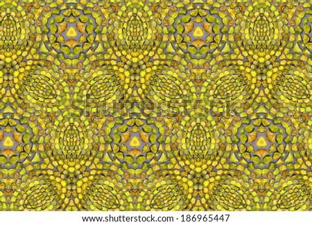 Yellow background with a traditional arabic pattern made from little stones