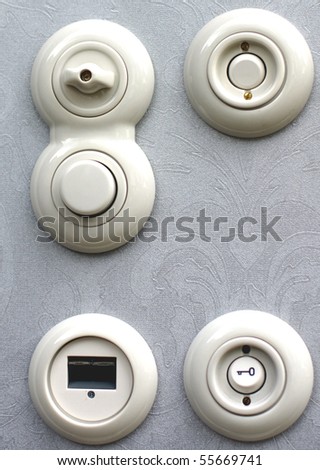 white electricity buttons and light switches