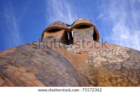 BARCELONA - FEBRUARY 18: The famous architect Gaudi­ treated rooftop chimneys like pieces of art on the rooftop of the house Casa Batllo on February 18, 2011 Barcelona, Spain