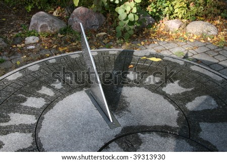 sundial casting a shadow on roman numerals