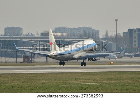 This is a view of PLL LOT plane Embraer ERJ170 registered as SP-LIE in retro painting on the Warsaw Chopin Airport. April 11, 2015. Warsaw, Poland.