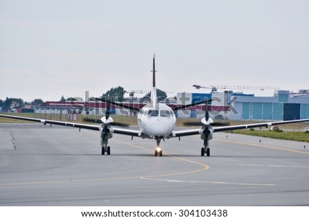 This is a view of Sprint Air plane Saab 340A registered as SP-KPC on the Warsaw Chopin Airport. July 30, 2015. Warsaw, Poland.