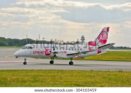 This is a view of Sprint Air plane Saab 340A registered as SP-KPC on the Warsaw Chopin Airport. July 30, 2015. Warsaw, Poland.
