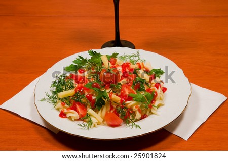 Italian paste with  tomatoes, dill, parsley and cheese on a cook-table