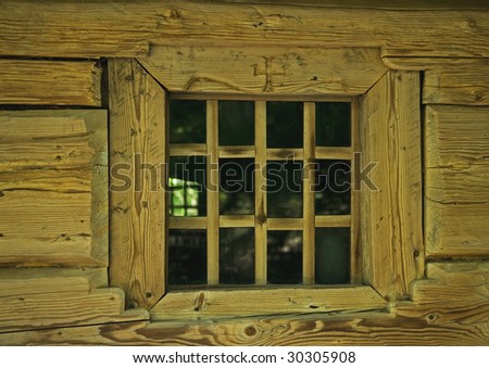 Wall and window of old, wooden house is in the country