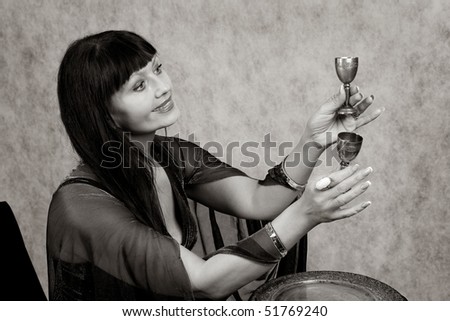 Beautiful woman of forty-five years  and silver wineglass