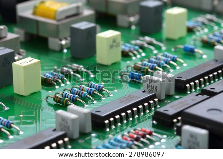 Detail of an electronic printed circuit board with many electrical components-(soft fogus)