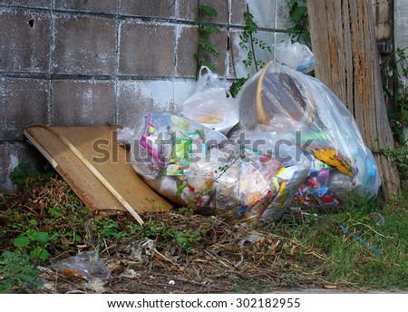 Improperly disposed bags of litter waste