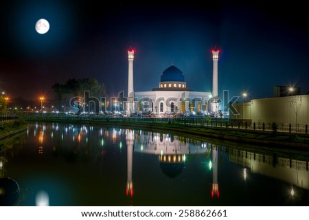 Beautiful Night Shot of Big New Mosque Minor, With Reflection in Water Under a Full Moon. Uzbekistan, Tashkent.