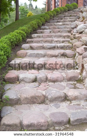 Long outdoor stone steps in a park leading up hill