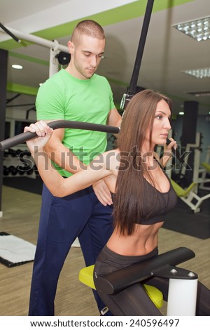 In the gym - couple are exercising in the gym