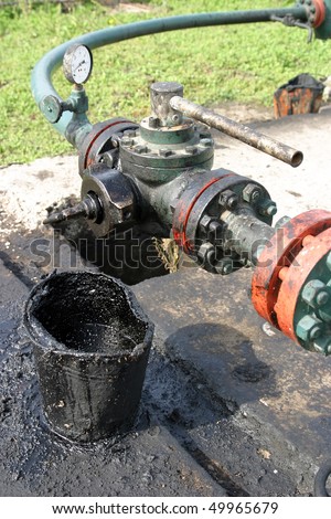 Leaking oil from pipes. Ground pollution