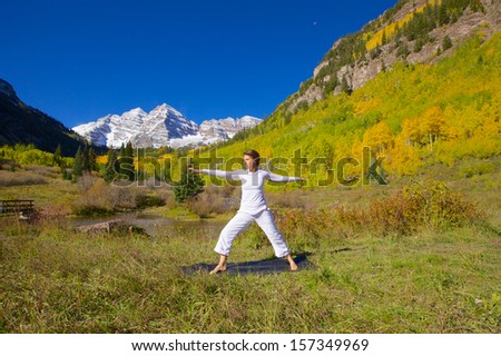 Woman Practicing Yoga at Maroon Bells in Fall