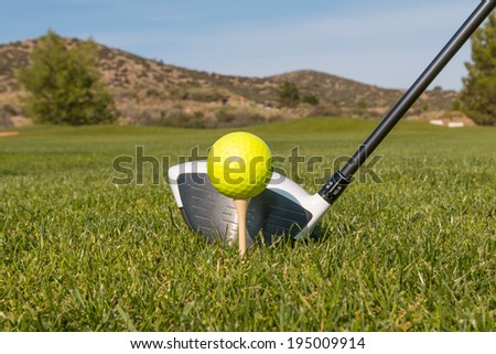 Driver and Golf Ball on the Tee