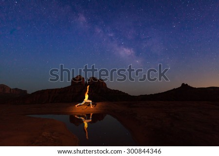 Practicing Yoga at Cathedral Rock Under the Milky Way