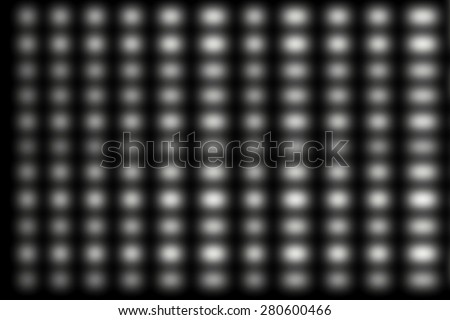 A Pattern Of white dots design blur of focus on a black background.