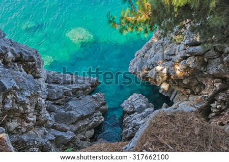 Top view of cliffs, bays, clear sea