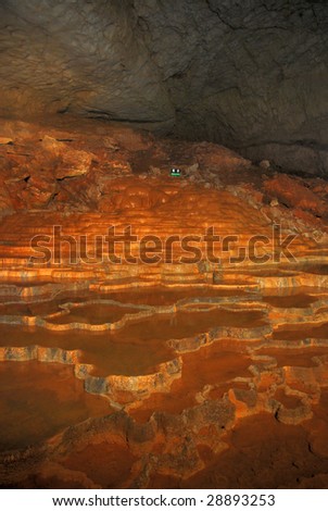 Interior of a limestone cave with limestone forming a never-ending flight of steps