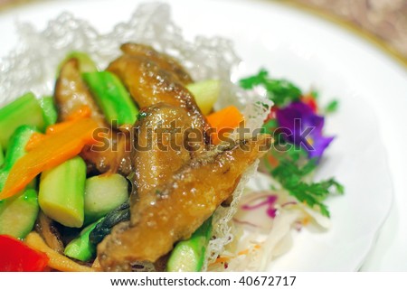 Sumptuous and healthy-looking Asian style vegetarian cuisine. Mixed vegetable main dish cooked with various vegetables, asparagus, carrots, mushrooms and mock meat.