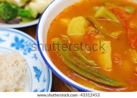 Homemade Chinese vegetarian curry. Ingredients include potatoes, lady fingers, and tomatoes. Suitable for food and beverage, healthy lifestyle, and diet and nutrition.