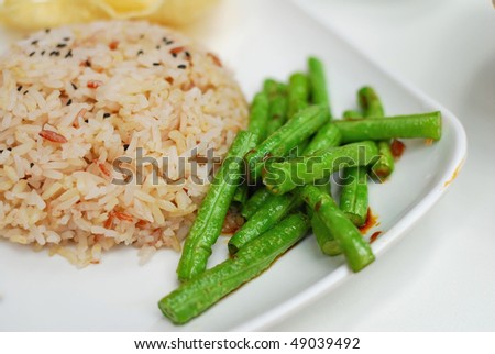Healthy unpolished red rice and beans. Suitable for concepts such as diet and nutrition, healthy lifestyle, and food and beverage.
