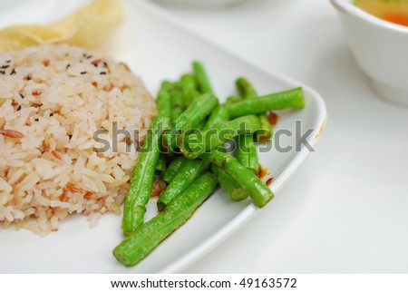 Healthy unpolished red rice and beans. Suitable for concepts such as diet and nutrition, healthy lifestyle, and food and beverage.