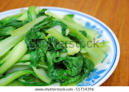 Simple green leafy vegetables cooked Chinese style. For concepts such as food and beverage, diet and nutrition, and healthy eating.