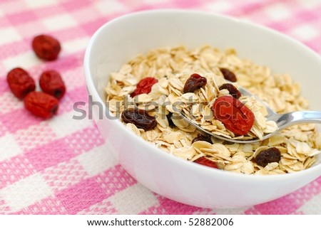 Spoonful of healthy oatmeal for a nutritious and healthy breakfast or meal. Also for healthy eating and lifestyle, diet and nutrition, and food and beverage concepts.