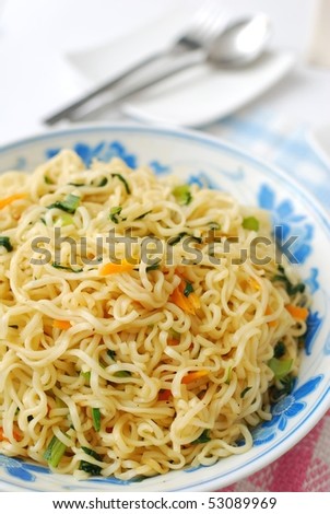 Close shot of huge serving of Chinese vegetarian noodles cooked with healthy vegetables. Suitable for concepts such as diet and slimming, healthy lifestyle, and food and beverage.