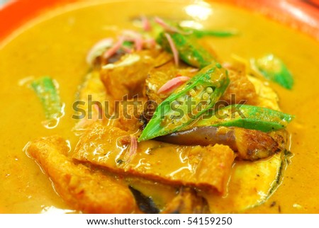 Chinese vegetarian curry cooked with mock fish meat, lady fingers and tomatoes. Suitable for food and beverage, healthy lifestyle, and diet and nutrition.