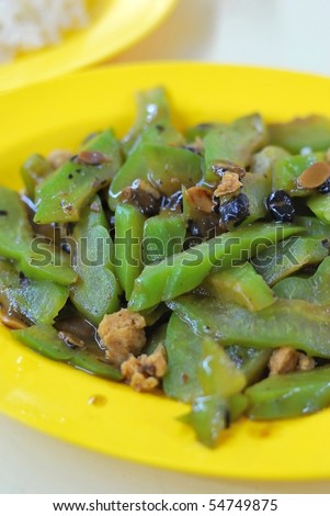 Healthy bitter gourd cuisine. Concepts such as food and beverage, and travel and cuisine, and diet and nutrition.