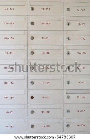 Row of metallic letter boxes with numbers and locks. For concepts such as safety and security, business communication and concepts.