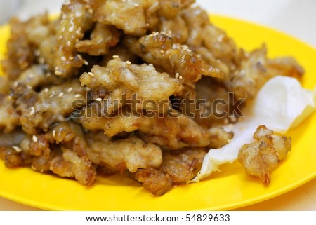 Deep fried mushroom delicacy made from abalone mushrooms. Concepts such as food and beverage, and travel and cuisine, and diet and nutrition.