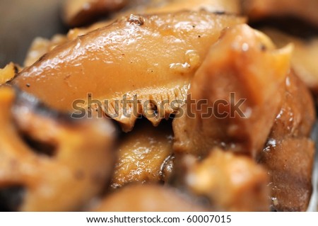 Macro of cooked shitake mushrooms as cooking ingredients, especially used in Asian cuisine such as Chinese and Japanese. For concepts such as food and beverage, healthy eating, and diet and nutrition.
