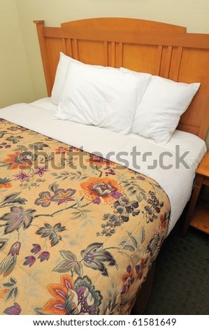Single bed in hotel room for generic concepts. Suitable for concepts such as budget travel, tourism, vacation and holiday, and relaxation.