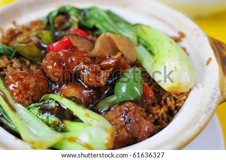 Delicious vegetarian sweet and sour pork cuisine. Ingredients include deep fried mock meat and healthy greens. Suitable for food and beverage, healthy lifestyle, and creative food.