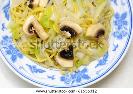 Simple instant noodles with mushrooms and vegetables. Suitable for concepts such as diet and nutrition, healthy lifestyle, and food and beverage.