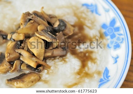 Healthy asian style porridge cooked with fresh mushrooms. For diet and nutrition, healthy eating and lifestyle concepts.
