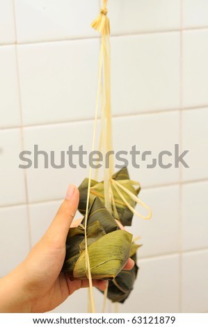 Asian glutinous dumplings wrapped in bamboo leaf. For food and beverage, culture and creative cuisine concepts.