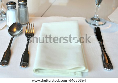 stock photo Restaurant table layout with white kitchen utensils before 