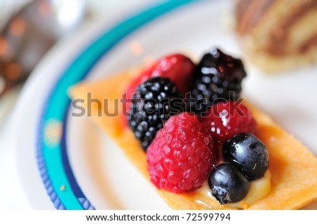Single serving of fruit tart dessert made with a variety of healthy berries.