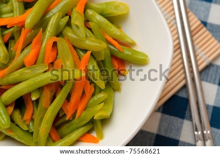 Chinese long beans cooked with carrot slices.
