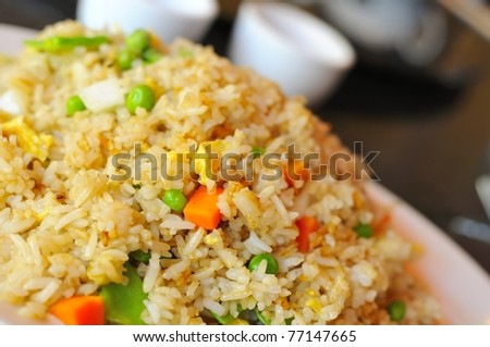 Typical Asian style fried rice dish prepared from colorful and healthy vegetables.