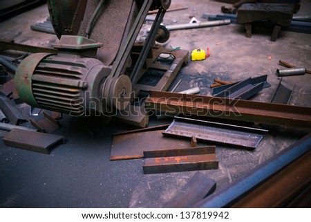 cutting machine and steel materials in a workshop