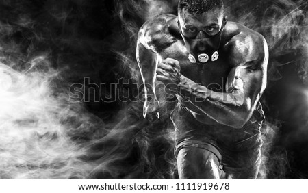 Strong athletic man sprinter in training mask, running, fitness and sport motivation. Runner concept with copy space. Dynamic movement.