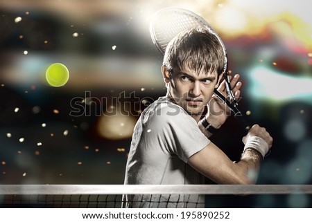 Young male tennis player hitting ball
