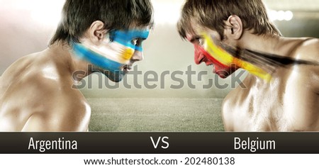 Two soccer fans with flags face to face. Argentina and Belgium